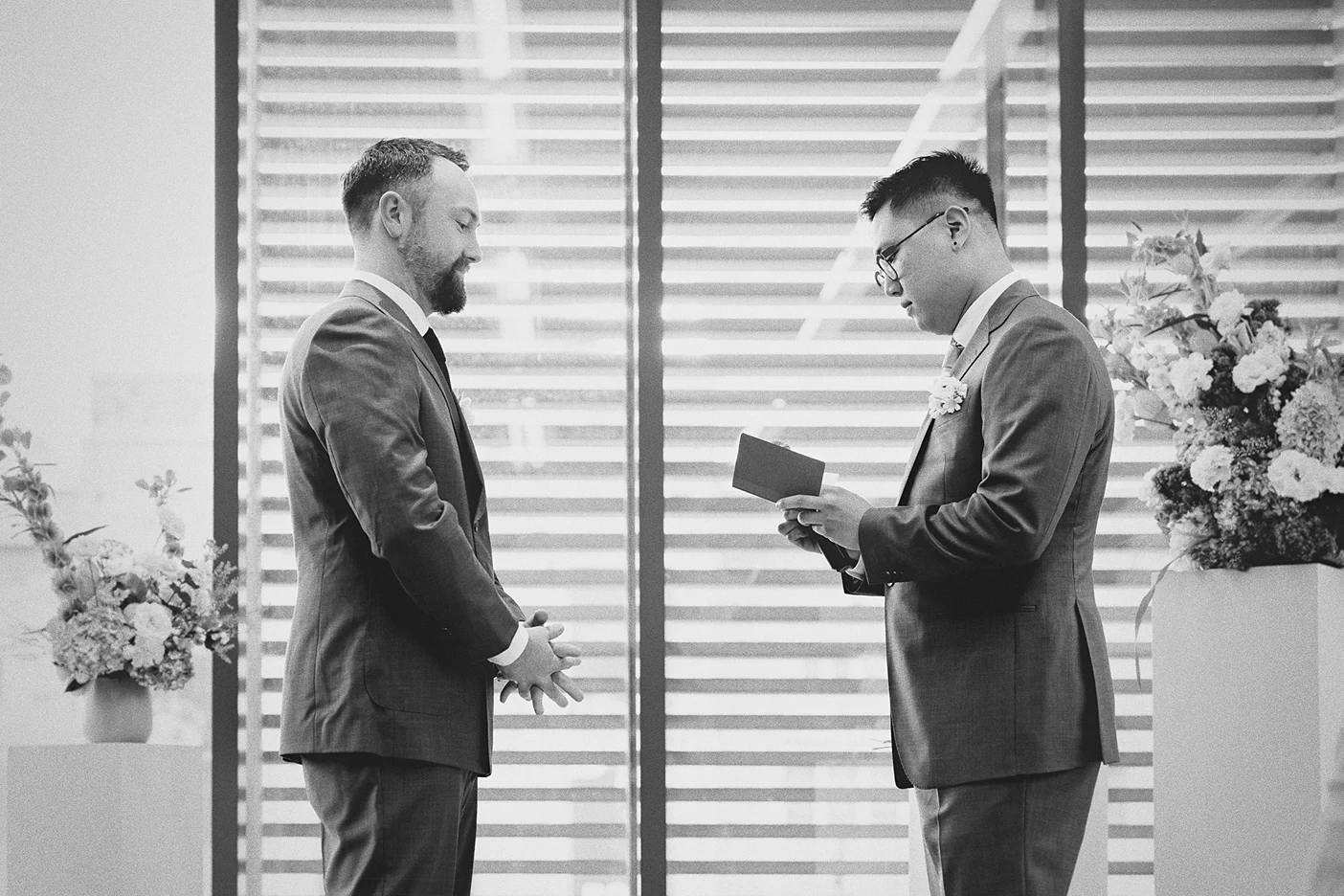 Ky reads his personal vows to Connor during the ceremony.