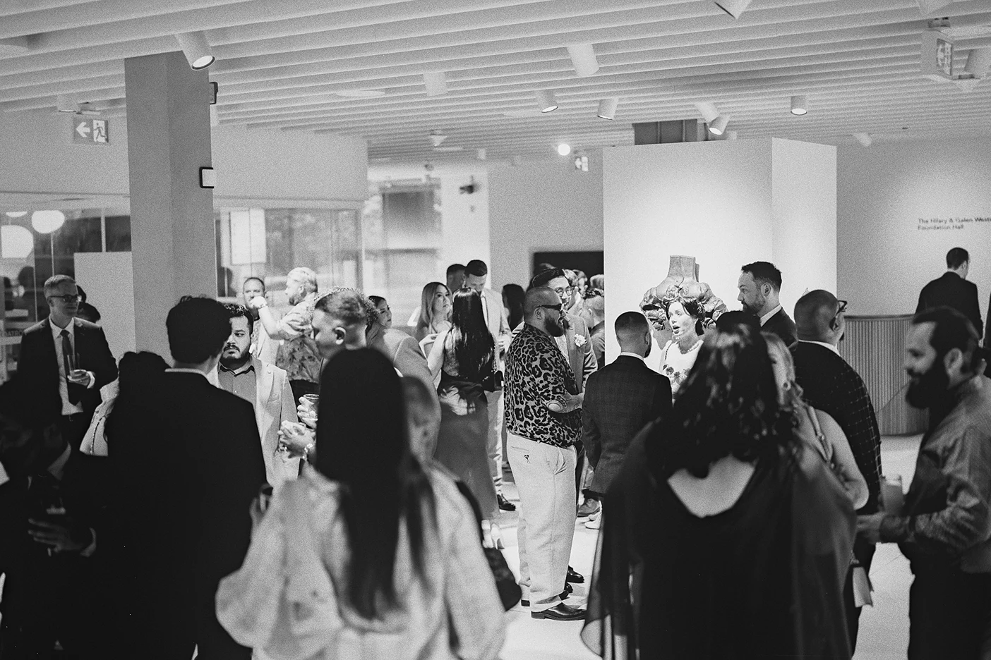 Guests mingle and enjoy the cocktail hour at the Gardiner Museum.