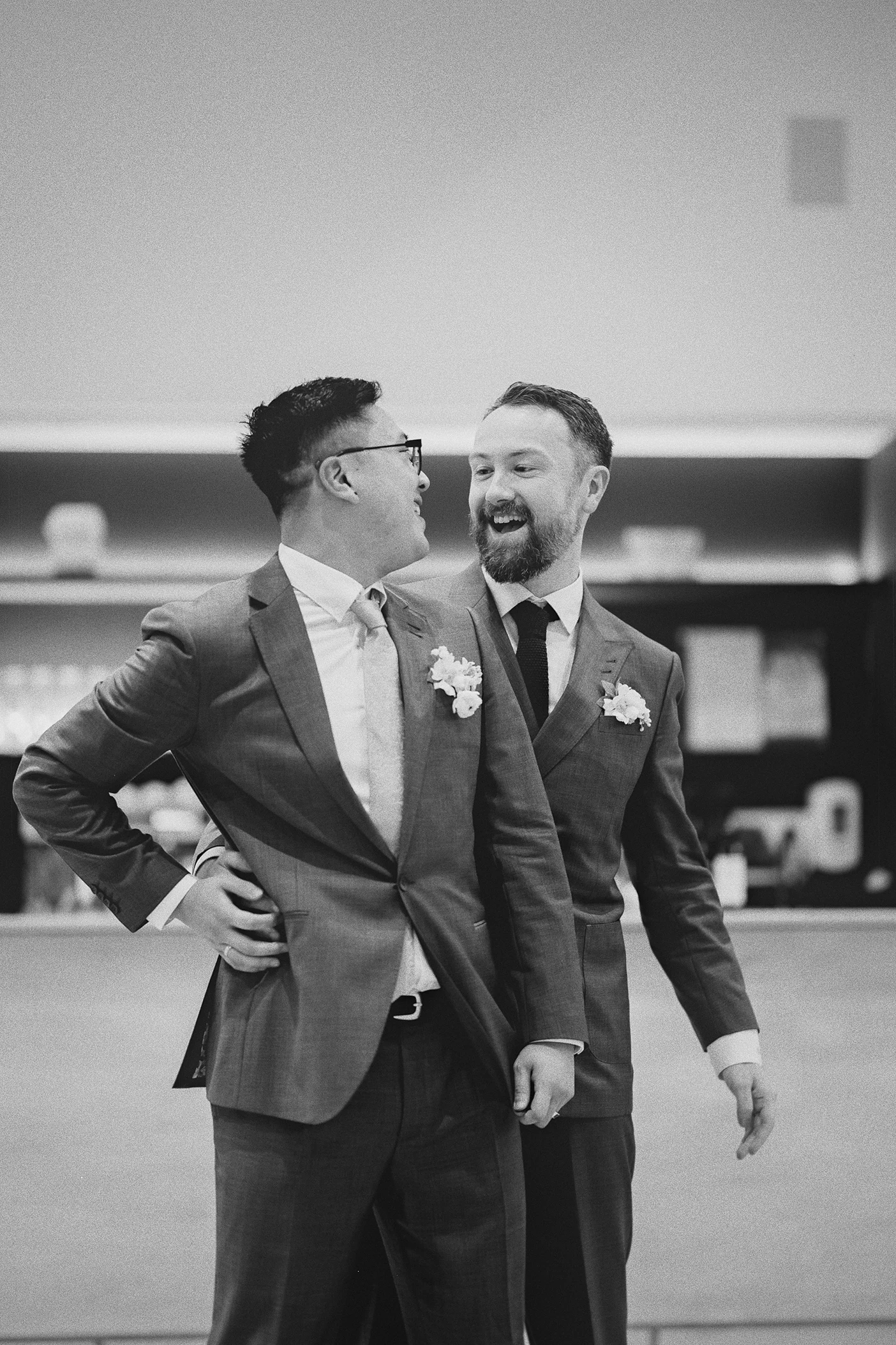 The couple laughs and dances at their wedding reception.