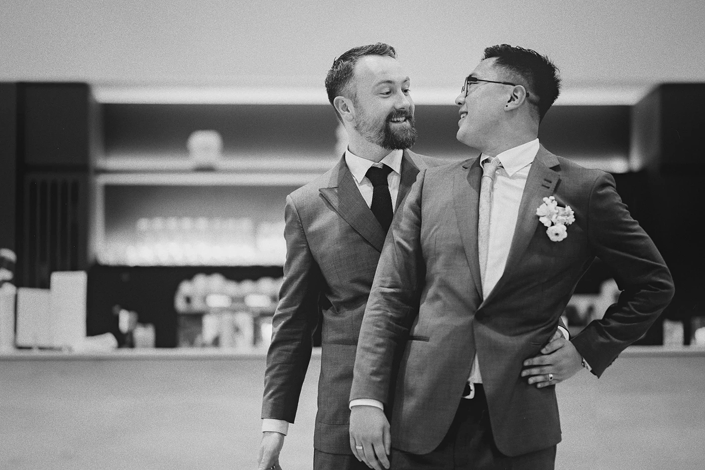 The grooms share a happy moment on the dance floor.