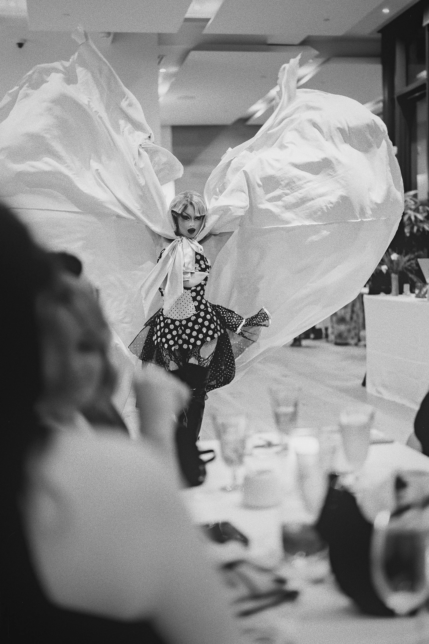 A drag queen performs for guests during the wedding dinner.