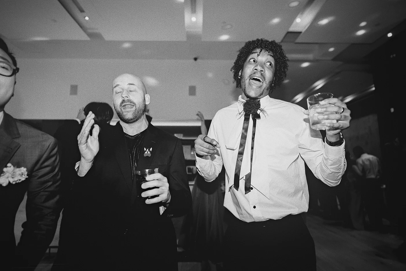 Guests sing along to the music on the dance floor.