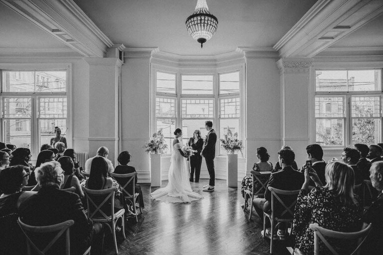 a wedding ceremony in the Drawing Room of The Great Hall in Toronto